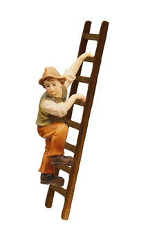 Niño tirando del belén de Kostner