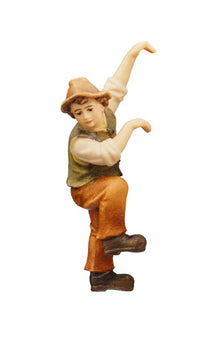 Niño tirando del belén de Kostner